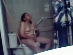 On the crapper bowl, chubby amateur black-haired nymphos masturbate.